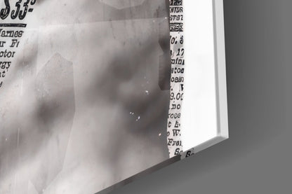 Close-up of the glossy tempered glass edge on the marble statue on red newsprint collage print