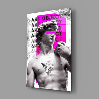 Marble statue on magenta newsprint collage glass wall art angled against a soft gray backdrop
