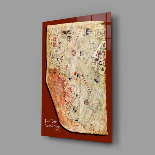 Historic world map glass wall art on a gray wall with a window reflection on the glossy surface