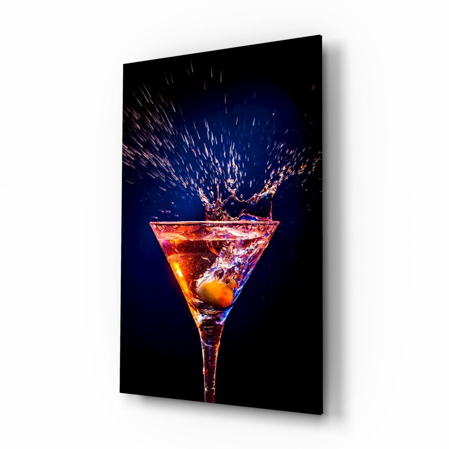 Cocktail glass wall art with martini splash and indigo background