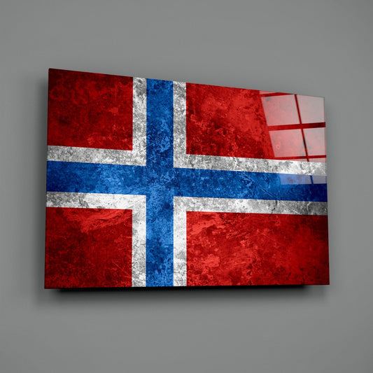 Deep red stone Norway flag glass wall art angled on a gray backdrop with light reflecting off the glossy front