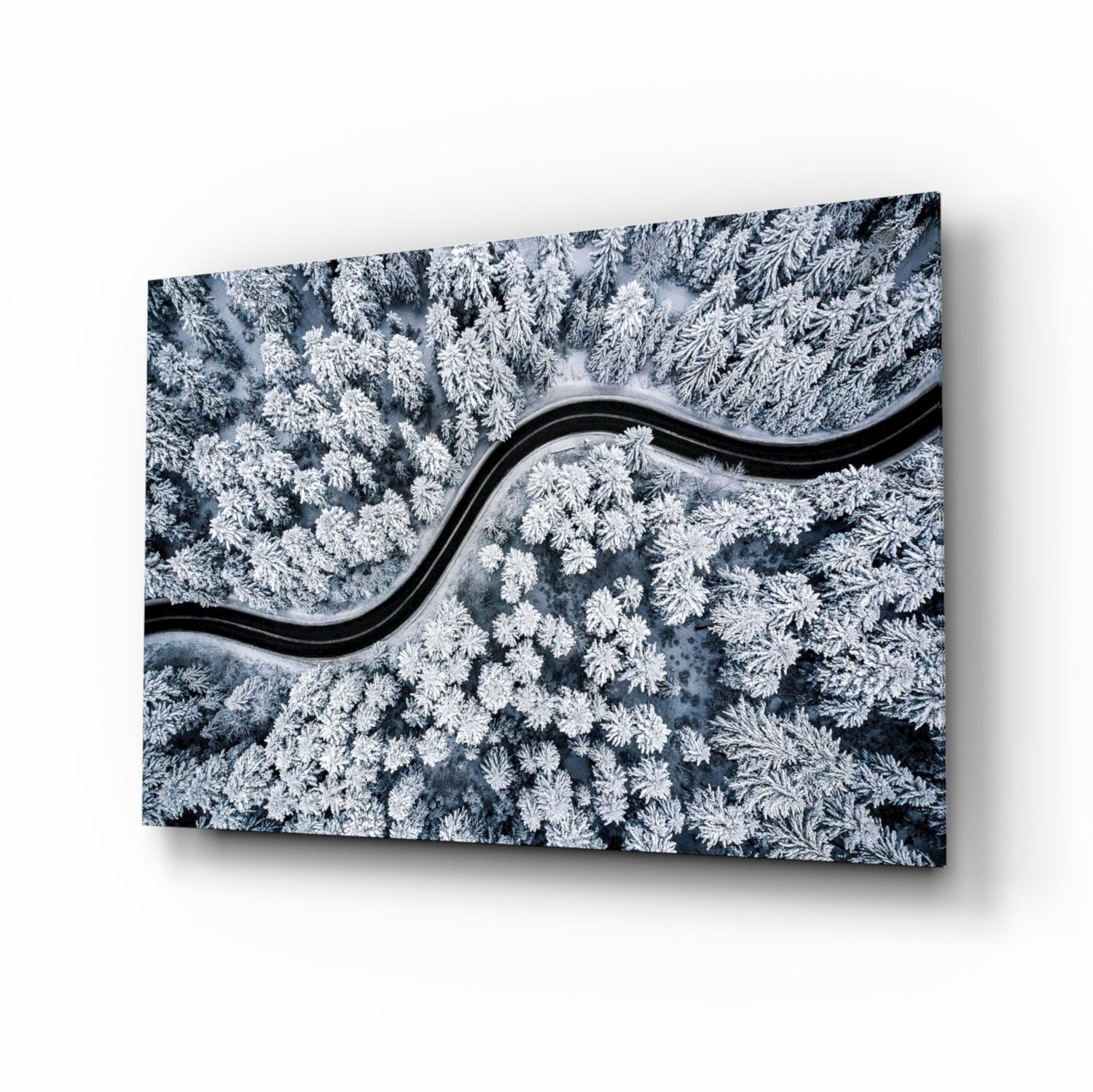 Snowy forest road aerial glass wall art