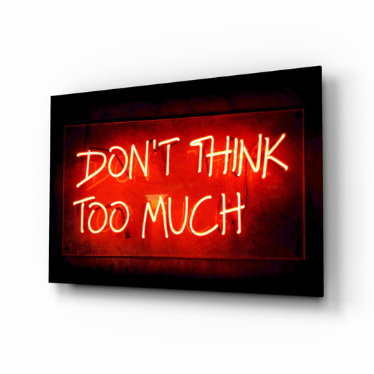 Red neon motivational phrase glass wall art on a white background, shown at an angle