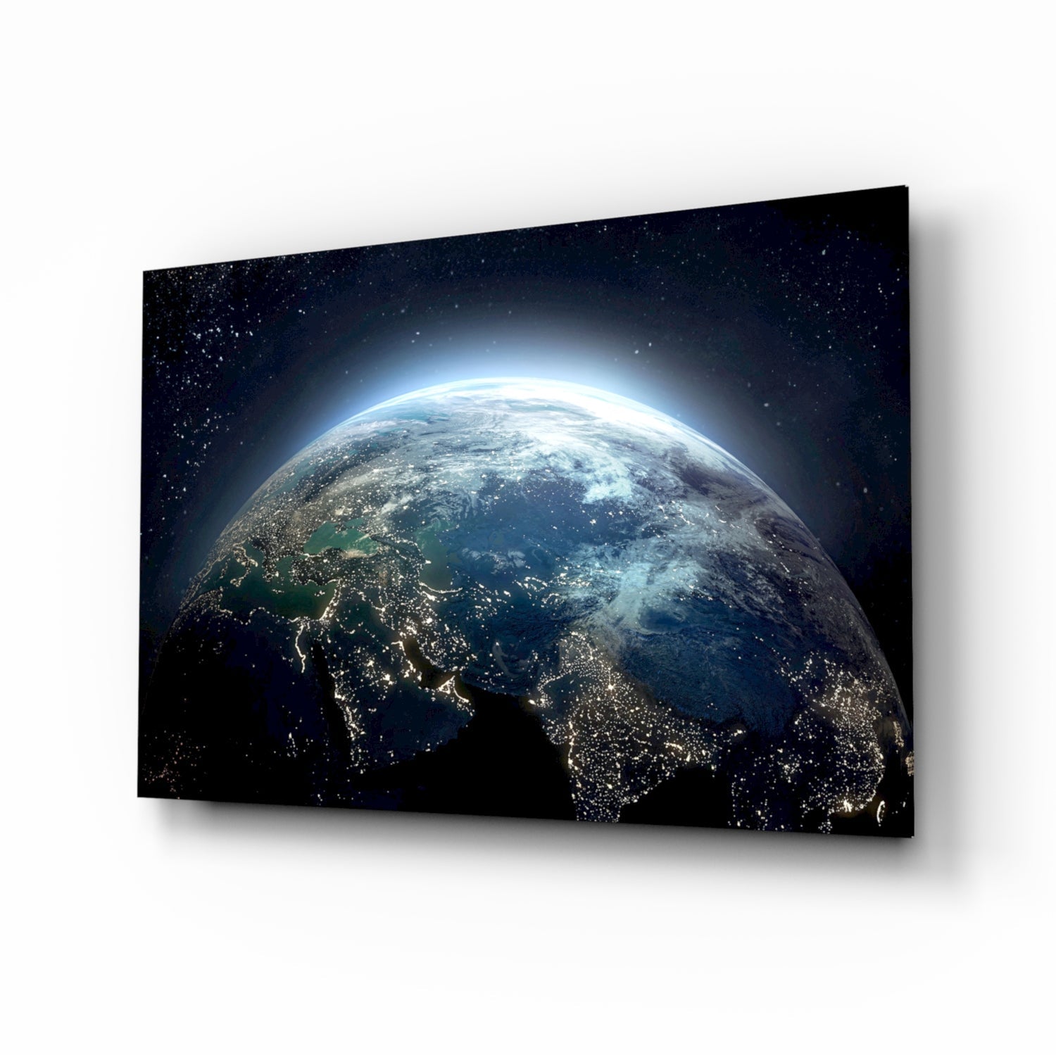 Earth at Night glass wall art in a modern living room