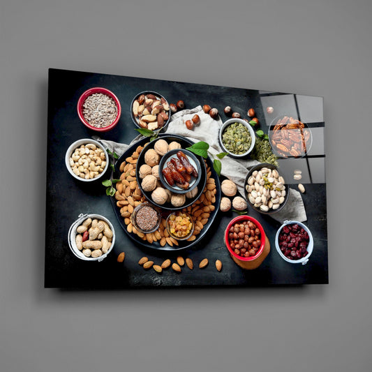 Mixed nuts bowls glass wall art on a gray wall, light reflecting off the glossy front