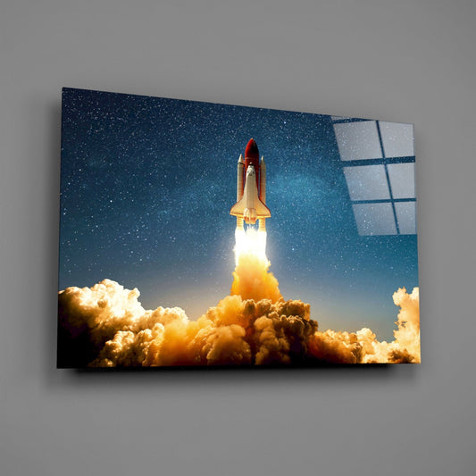 Shuttle launch glass wall art on a gray wall, light reflecting off the glossy front