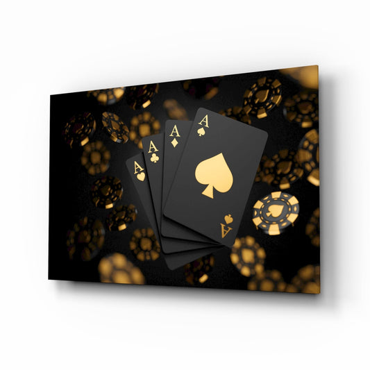 Four black ace cards with gold suits fanned among floating gold poker chips, glass wall art