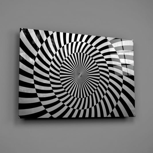 Optical spiral glass wall art on a gray wall, light reflecting off the glossy front