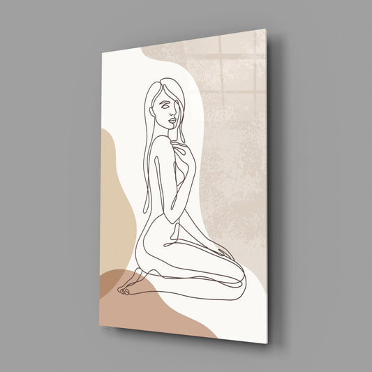 Kneeling woman line art glass wall art on a gray wall, light reflecting off the glossy front