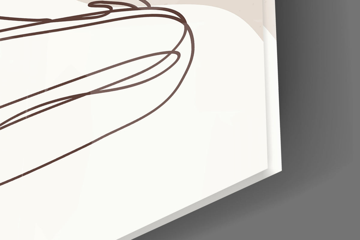 Close-up of the glass edge and glossy surface over the black line drawing on cream