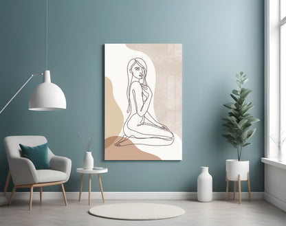 Kneeling woman line art glass wall art on a blue wall above a cream armchair and pendant lamp