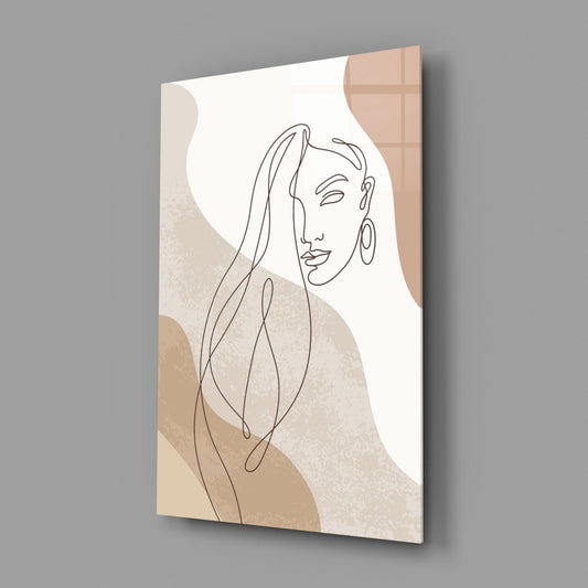 Line art woman with flowing hair glass wall art on a gray wall with a window reflection across the glossy glass