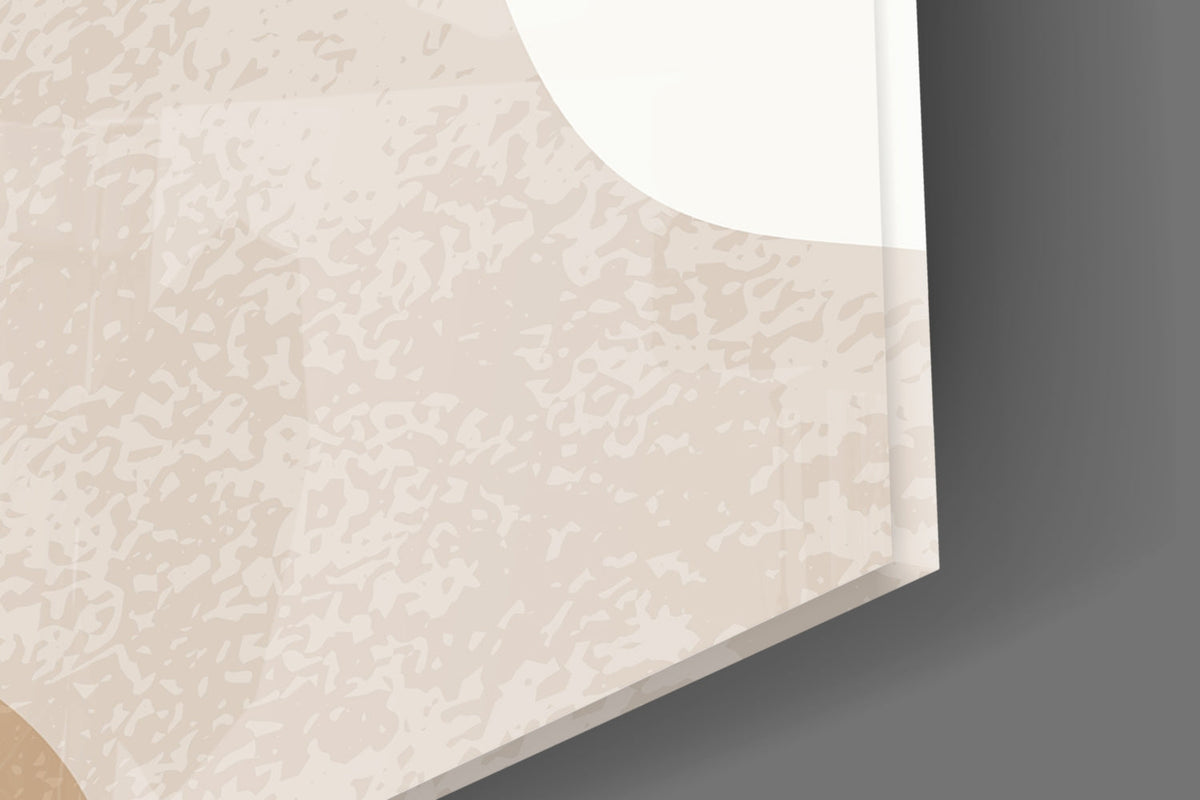 Close-up of the glossy tempered glass edge over the soft sand-colored shapes