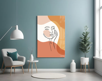 Terracotta line art face glass wall art on a blue wall above a cream armchair and pendant lamp