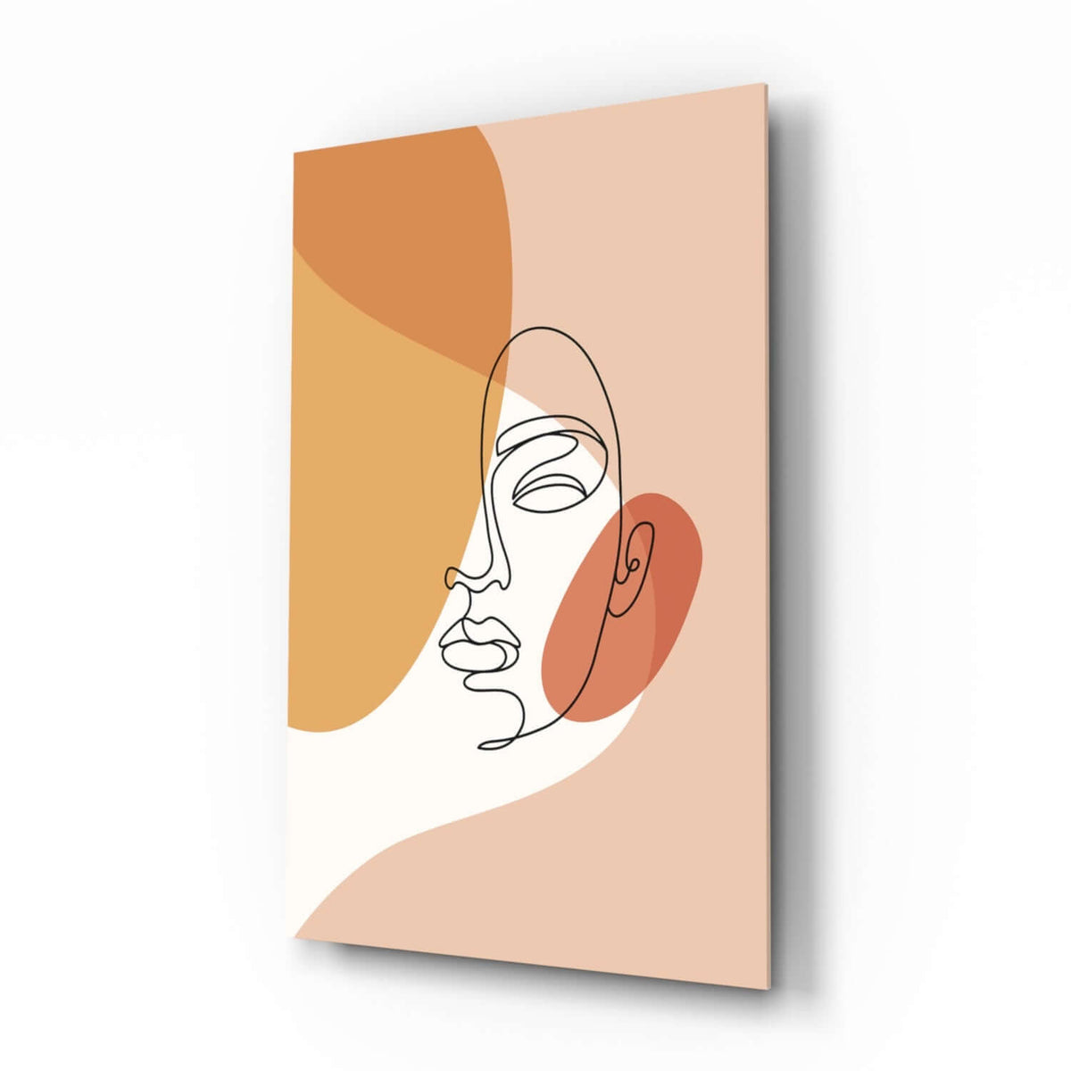 Single line drawing of a woman's face with closed eyes over orange, peach and rust shapes on cream, glass wall art