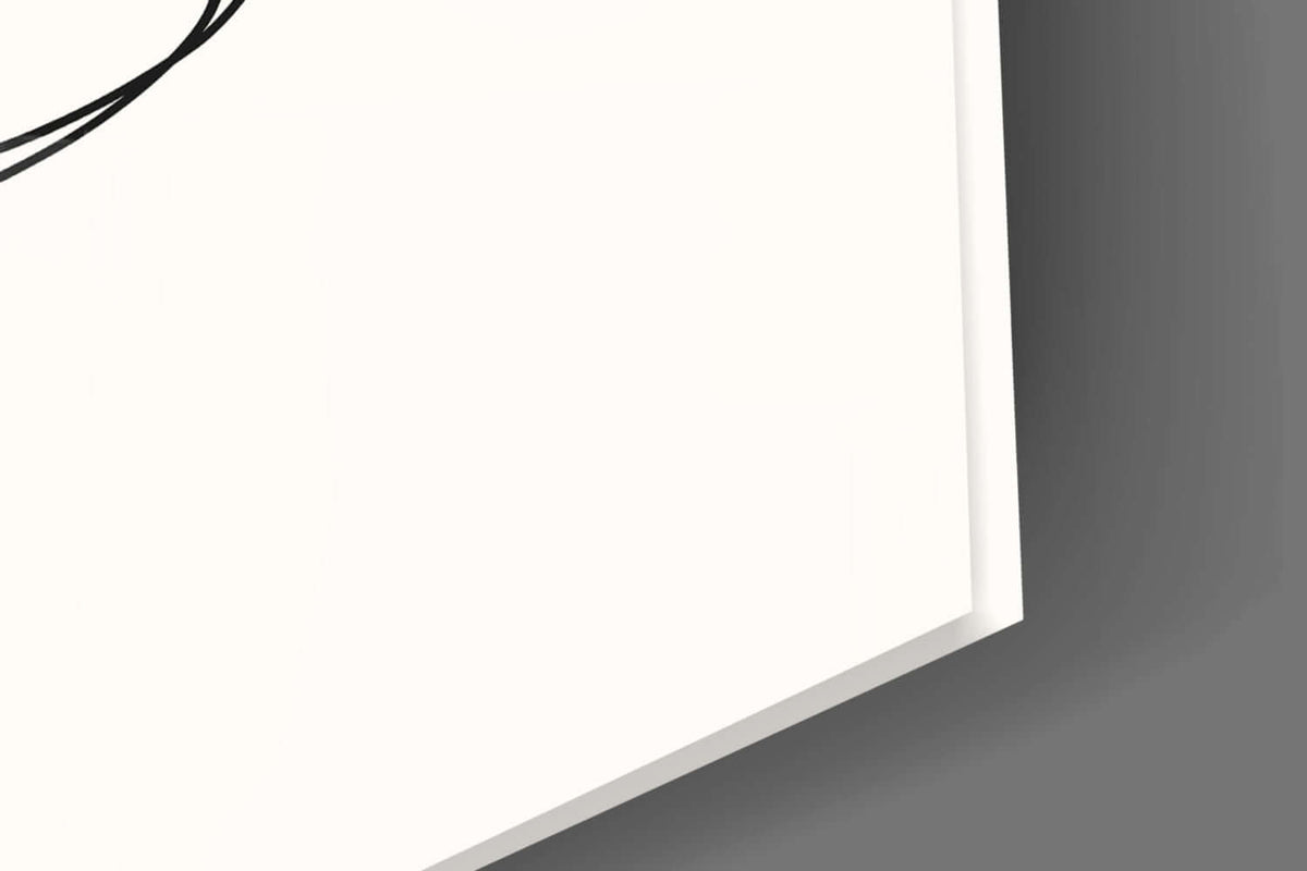 Close-up of the glossy tempered glass edge over the cream background