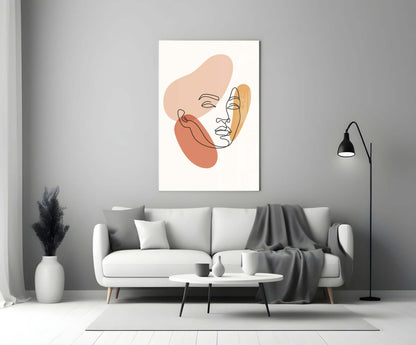 Line art woman face glass wall art above a white sofa beside a black arc floor lamp