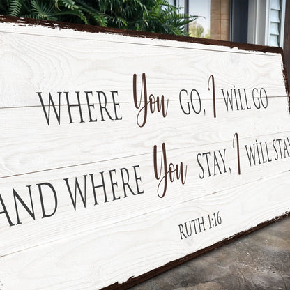 Angled close-up of the Ruth 1:16 Where You Go I Will Go canvas sign showing the lettering and dark edge